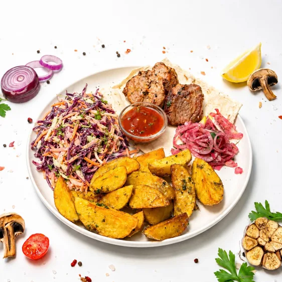 Plate with pork neck kebab