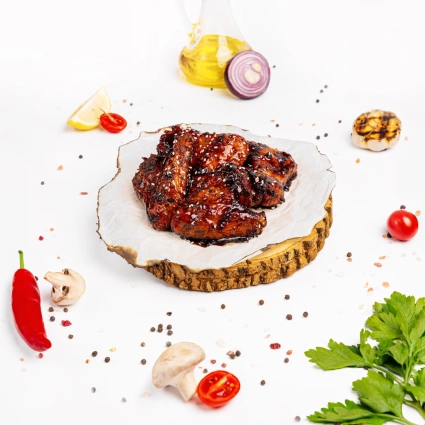 Курячі крильця карамелізовані